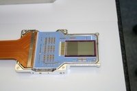 eROSITA detector integrated in the housing. Mounted on the right-hand side of the blue detector board is the CCD chip (384 x 384 pixels with pixel size of 75 x 75 µm<sup>2</sup>), while the electrical interface to the camera electronics is attached on the left-hand side.