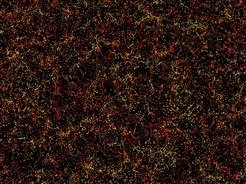 <p>Galaxien wie Sand am Meer: Dies ist ein Schnitt durch die Karte der großräumigen Struktur des Universums aus dem Sloan Digital Sky Survey und seinem Unterprogramm, dem Baryon Oscillation Spectroscopic Survey (BOSS). Jeder Punkt in diesem Bild zeigt die Position einer Galaxie vor sechs Milliarden Jahren. Das Bild umfasst etwa 1/20 des Himmels – einen Ausschnitt des Weltalls, der sechs Milliarden Lichtjahre breit, 4,5 Milliarden Lichtjahre hoch und 500 Millionen Lichtjahre dick ist. Die Farbe ist ein Maß für die Entfernung von der Erde, von gelb für Galaxien auf der uns zugewandten Seite der Scheibe bis zu lila auf der weiter entfernten Seite. Galaxien klumpen, sie zeigen große Haufen und Hohlräume dazwischen. Dies blasenförmige Struktur wurde bereits im ersten Bruchteil einer Sekunde nach dem Urknall angelegt. Das Bild enthält 48.741 Galaxien, etwa drei Prozent des gesamten Katalogs. Graue Flecken sind kleine Regionen ohne Daten.</p>