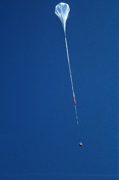 Balloon, parachute, and gondola shortly after launch. The ballon is filled only in part because at float altitude the gas (Helium) expands and fills the whole volume.