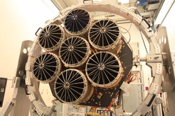 After about ten years of development and integration the eROSITA X-ray telescope is complete: with 7 mirror modules and 54 mirror shells each combined with 7 specially built X-ray cameras. You see the telescope here after final integration at MPE, shortly before transport to further testing.