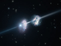 <span class="small">This artist's impression shows two galaxies in the early Universe. The brilliant explosion on the left is a gamma-ray burst. The light from the burst travels through both galaxies on its way to Earth (outside the frame to the right). Analysis of observations of the light from this gamma-ray burst made using ESO's Very Large Telescope have shown that these two galaxies are remarkably rich in heavier chemical elements. </span>