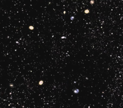 A still image from a video fly-through of the SDSS-III galaxies mapped in Data Release 9. (You can find the video on the SDSS press release site - for a link see right column.) Galaxies are concentrated into clusters and filaments with voids in between. The SDSS-III is exploring this structure to determine the nature of dark energy and the distribution of dark matter in the Universe.