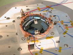 Fig. 6. A spherical-aspherical meniscus lens made from CaF2 mounted on a shaker table.
