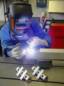 Arc welding a valve disc