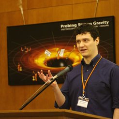 Jason Dexter, giving at talk about black holes
