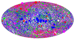 Aitoff projection in Galactic coordinates of the sky distribution of 2RXS sources. The size of the symbols scales with the source count rate and the colours represent different spectral characteristics (increasing hardness ratio 1 from red (soft) to blue (hard).