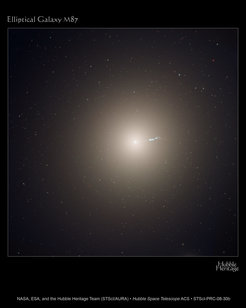 This Hubble image shows the elliptical galaxy M87, the dominant galaxy at the centre of the neighbouring Virgo cluster of galaxies. The jet is a black-hole-powered stream of material that is being ejected from the core of the galaxy.