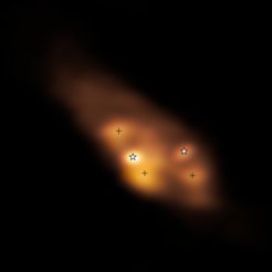 A detailed look at the young binary stars (marked by star symbols) in the system IRAS 16293–2422. In this radio image taken with the Atacama Large Millimeter/submillimeter Array in Chile the colour indicates the temperature distribution of the protostars and their surroundings, with white representing high temperatures. The three hot spots (marked by crosses) are most likely heated by shocks, not by the protostars themselves.